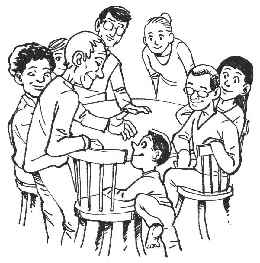 An old man offering his chair to a young boy, with the other people around the table smiling as he joins.